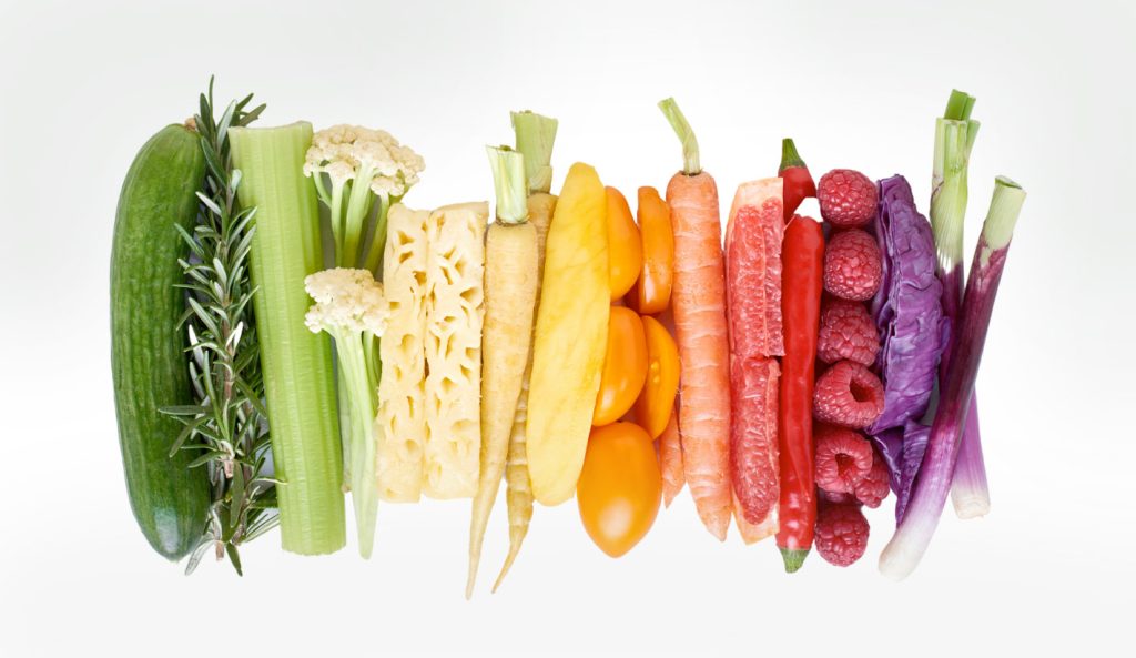 foods arranged in rainbow colors