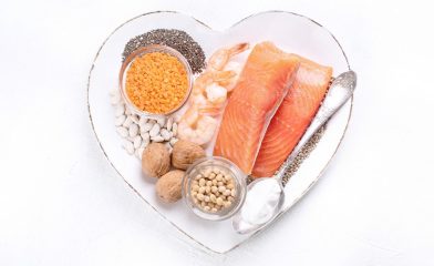 heart-shaped plate with salmon and cooking ingredients