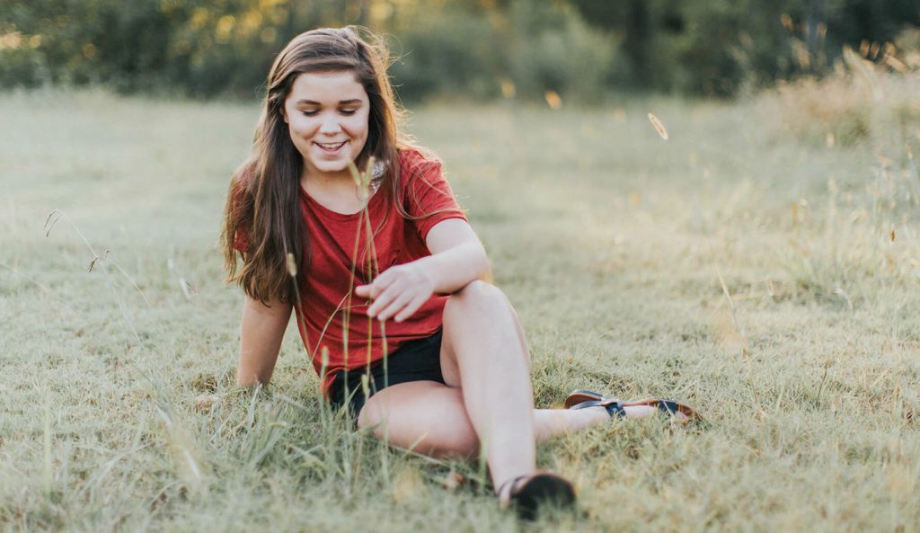 teen girl relax on a meadow