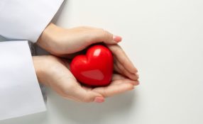 heart held in provider's hands - cardiac rehabilitation