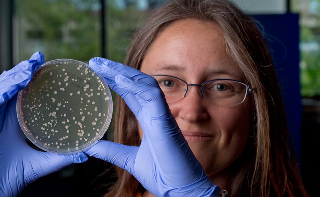 Katrine Whiteson holding petri dish