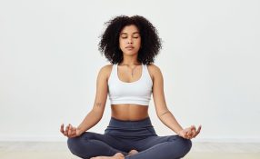 Woman seated calmly meditating