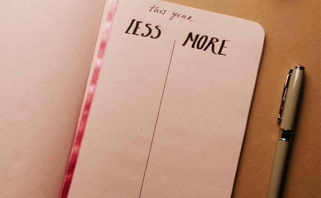 Journal with New Year List: Less and More and pen
