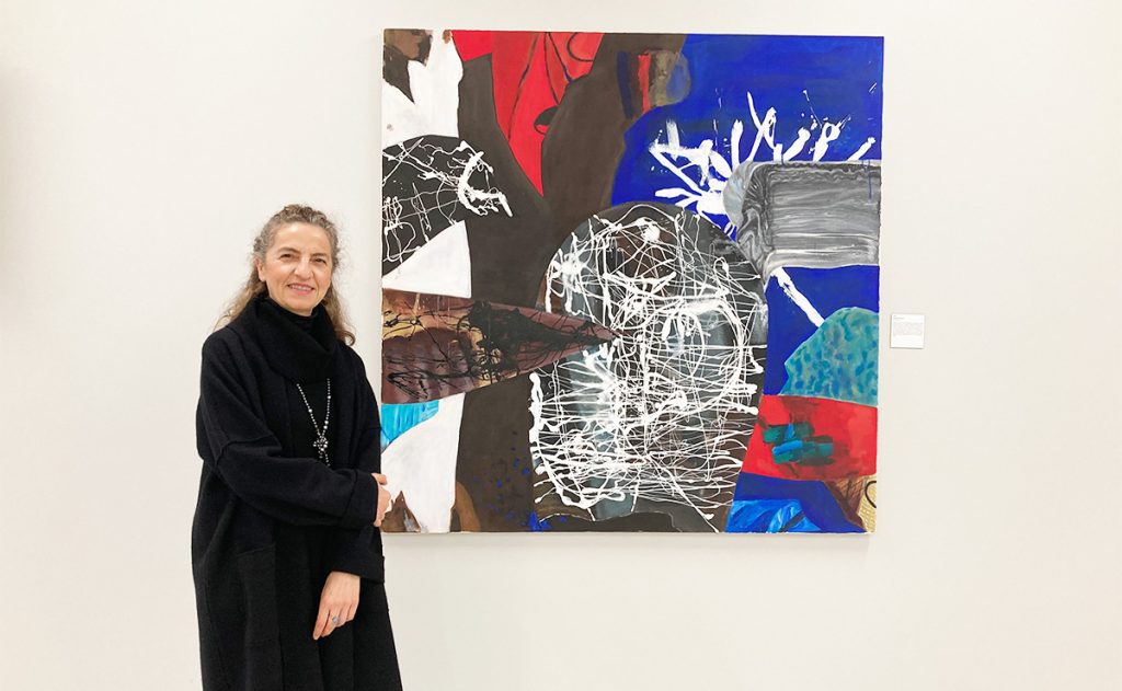 Raphaele Cohen-Bacry with her painting "Riddle"