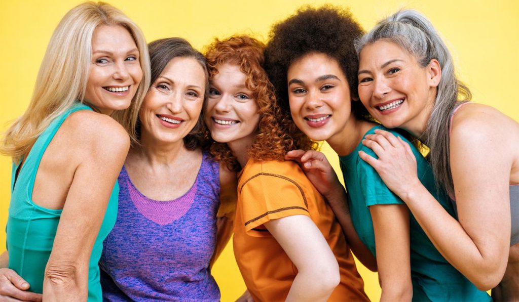 Group of women of various ages smiling together